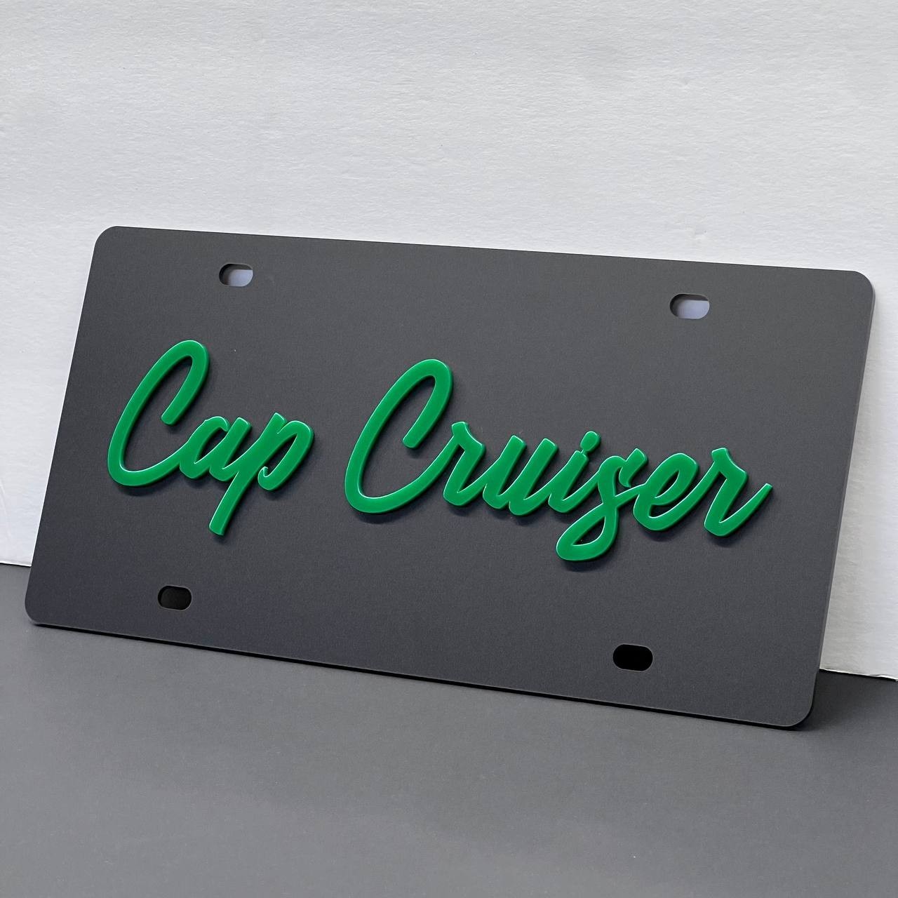 An acrylic license plate frame fitted around a license plate