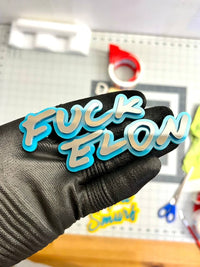 Anti Tesla Anti Elon Musk MULTI COLOR Emblem Badge (1pc)
