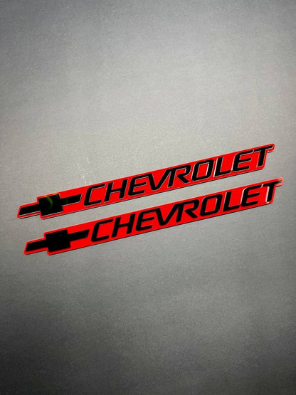 2PCS Black CHEVROLET Emblem Badges on Red Background – Aggressive 3D Styling