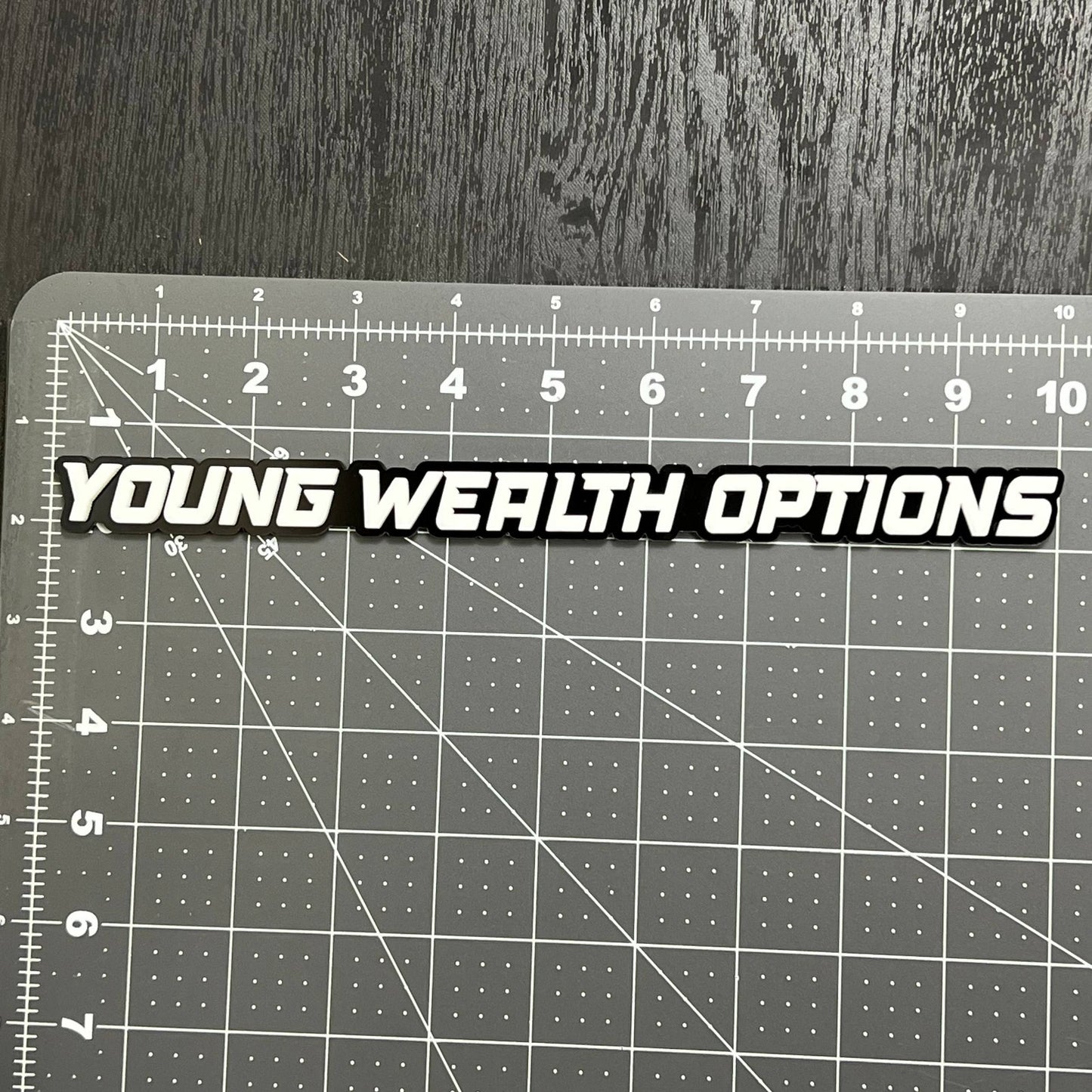 YOUNG WEALTH OPTIONS 3D Emblem – Multicolor Acrylic Car Exterior Badge (1PC)