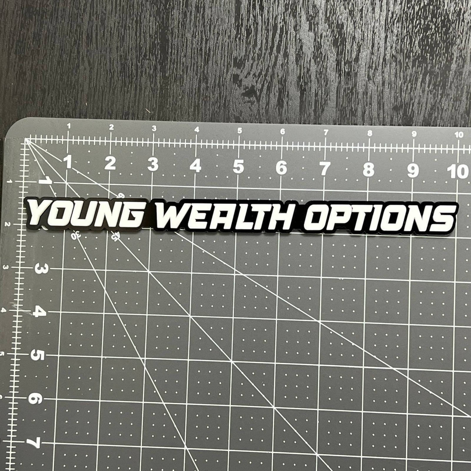 YOUNG WEALTH OPTIONS 3D Emblem – Multicolor Acrylic Car Exterior Badge (1PC)