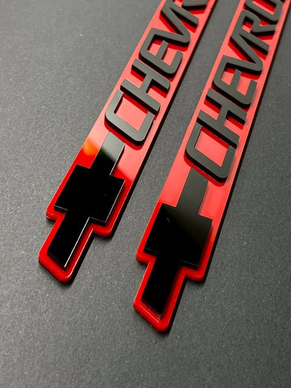 2PCS Black CHEVROLET Emblem Badges on Red Background – Aggressive 3D Styling