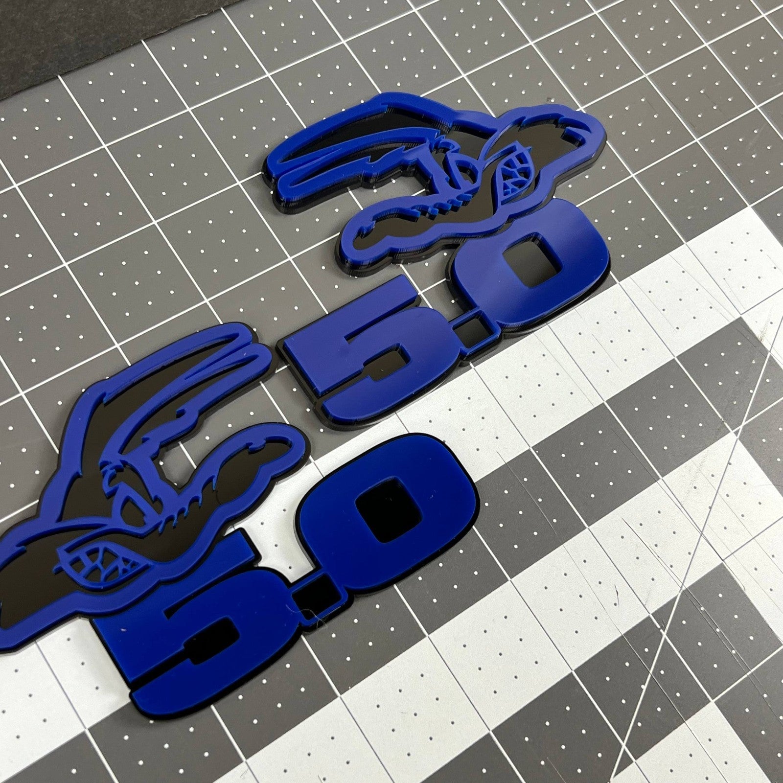 5.0 COYOTE 3D Emblems – Blue on Black Angry Racing Fender Badges (Set of 2)
