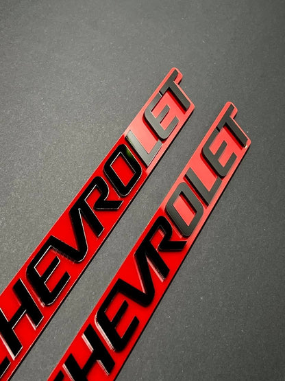 2PCS Black CHEVROLET Emblem Badges on Red Background – Aggressive 3D Styling