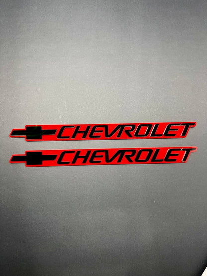 2PCS Black CHEVROLET Emblem Badges on Red Background – Aggressive 3D Styling