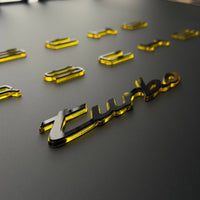 Porsche turbo script emblem cut in mirror acrylic with a gloss black face